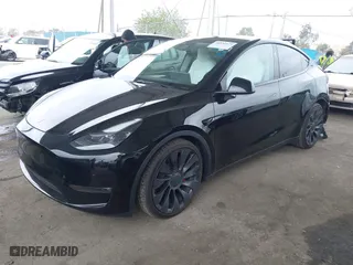 2023 Tesla Model Y Performance with VIN 7SAYGDEFXPF833273, listed as a IAAI auction lot 41892473 with 26,757 mi miles. Bid and sale history available at carsss.com. Image 22.