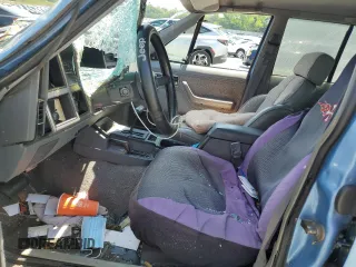 1991 Jeep Cherokee z VIN 1J4FJ58S0ML519252, wystawiony jako Copart lot #55458005 z przebiegiem 152 129 mil mil oraz Szkoda całkowita • Salvage title. Historia ofert i sprzedaży dostępna na DreamBid. Obrazek 7.