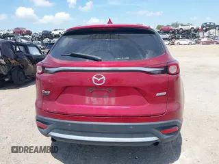 2019 Mazda CX-9 Grand Touring z VIN JM3TCADY5K0302436, wystawiony jako IAAI lot #42323545 z przebiegiem Nie podano mil oraz . Historia ofert i sprzedaży dostępna na DreamBid. Obrazek 16.