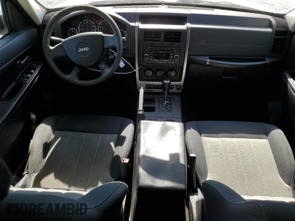 2010 Jeep Liberty Sport with VIN 1J4PP2GK9AW128825, listed as a Copart auction lot 48113835 with 258,730 mi miles and Salvage Title. Bid and sale history available at DreamBid. Image 8.