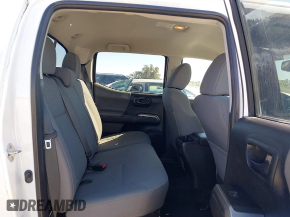 2018 Toyota Tacoma SR5 with VIN 5TFAZ5CN4JX056465, listed as a IAAI auction lot 41767848 with 71,532 mi miles and . Bid and sale history available at DreamBid. Image 8.