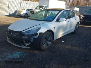 2018 Tesla Model 3 Long Range Battery with VIN 5YJ3E1EA0JF153146, listed as a IAAI auction lot 41621919 with 76,794 mi miles and . Bid and sale history available at DreamBid. Image 2.