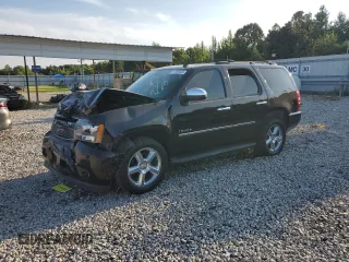 2014 Chevrolet Tahoe LTZ z VIN 1GNSCCE0XER103558, wystawiony jako Copart lot #67590424 z przebiegiem Nie podano mil oraz Szkoda całkowita • Salvage title. Historia ofert i sprzedaży dostępna na DreamBid. Obrazek 1.