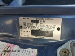 1986 Toyota Camry z VIN JT2SV16E6G0520922, wystawiony jako Copart lot #47146675 z przebiegiem 156 394 mil mil oraz Szkoda całkowita • Salvage title. Historia ofert i sprzedaży dostępna na DreamBid. Obrazek 13.