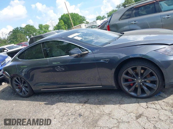2014 Tesla Model S P85D with VIN 5YJSA1H29EFP63032, listed as a IAAI auction lot 42132145 with Not Provided miles and . Bid and sale history available at DreamBid. Image 12.