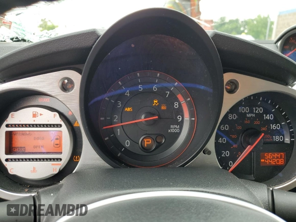 2009 Nissan 370Z Touring with VIN JN1AZ44E69M404789, listed as a Copart auction lot 62015094 with 56,447 mi miles and Salvage Title. Bid and sale history available at carsss.com. Image 9.