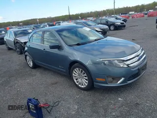 2011 Ford Fusion Hybrid with VIN 3FADP0L39BR264412, listed as a IAAI auction lot 42038511 with 134,166 mi miles. Bid and sale history available at carsss.com. Image 1.