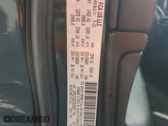2015 Jeep Grand Cherokee Overland with VIN 1C4RJFCG6FC919637, listed as a Copart auction lot 52072925 with 111,552 mi miles and Salvage Title. Bid and sale history available at carsss.com. Image 14.