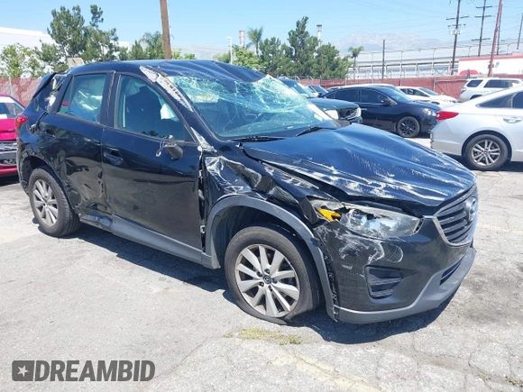 2016 Mazda CX-5 Sport with VIN JM3KE2BY4G0807776, listed as a IAAI auction lot 42206641 with 136,809 mi miles and . Bid and sale history available at DreamBid. Image 1.