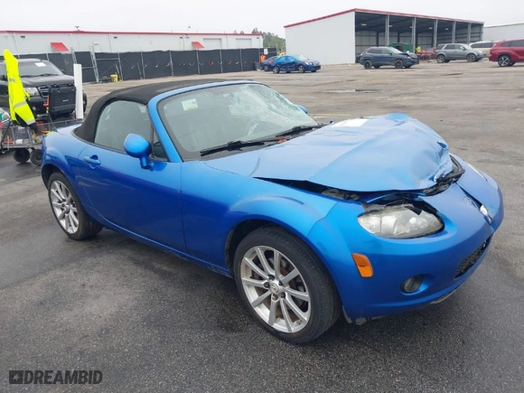 2006 Mazda MX-5 Miata Touring with VIN JM1NC25FX60102209, listed as a IAAI auction lot 41940771 with 165,003 mi miles. Bid and sale history available at carsss.com. Image 1.