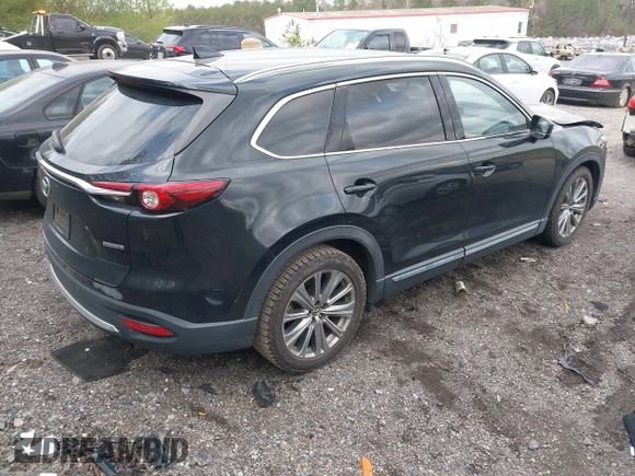 2021 Mazda CX-9 Carbon Edition with VIN JM3TCADY4M0517535, listed as a IAAI auction lot 41821261 with 60,053 mi miles. Bid and sale history available at carsss.com. Image 4.