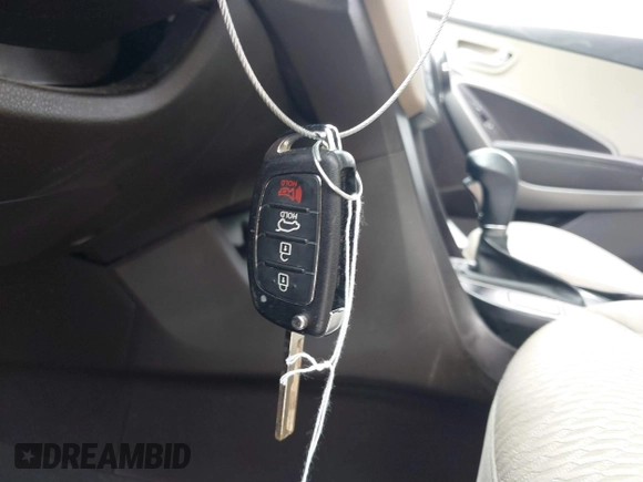 2016 Hyundai Santa Fe z VIN 5XYZT3LB1GG321854, wystawiony jako IAAI lot #40244942 z przebiegiem Nie podano mil oraz . Historia ofert i sprzedaży dostępna na DreamBid. Obrazek 11.