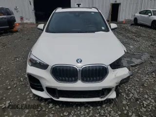 2021 BMW X1 xDrive28i with VIN WBXJG9C07M3M67312, listed as a Copart auction lot 59712835 with 62,371 mi miles and Salvage title. Bid and sale history available at DreamBid. Image 5.