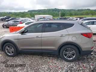 2018 Hyundai Santa Fe 2.4L with VIN 5NMZU3LB1JH100507, listed as a IAAI auction lot 42182116 with 103,826 mi miles and . Bid and sale history available at DreamBid. Image 14.