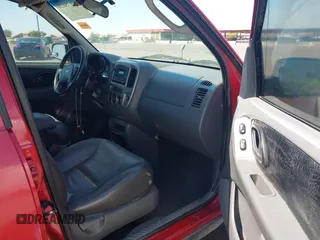 2003 Ford Escape XLT Popular 2 with VIN 1FMYU93123KB02310, listed as a IAAI auction lot 41975073 with 169,864 mi miles. Bid and sale history available at carsss.com. Image 5.