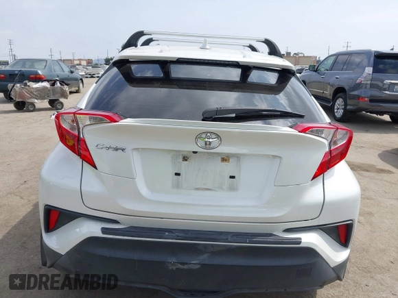 2019 Toyota C-HR XLE with VIN JTNKHMBX9K1054053, listed as a IAAI auction lot 42120256 with 67,083 mi miles and . Bid and sale history available at DreamBid. Image 16.