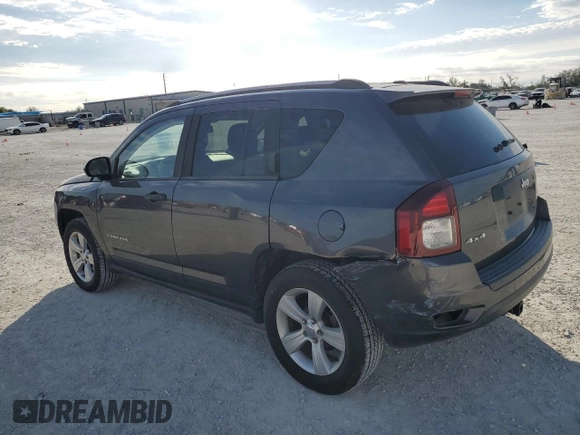 2016 Jeep Compass Sport SE with VIN 1C4NJDBBXGD523537, listed as a Copart auction lot 87664995 with 132,010 mi miles and Salvage title. Bid and sale history available at DreamBid. Image 2.