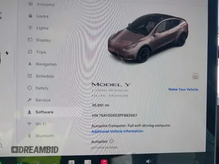 2023 Tesla Model Y Long Range with VIN 7SAYGDEE2PF883687, listed as a IAAI auction lot 41589837 with 36,890 mi miles. Bid and sale history available at carsss.com. Image 7.