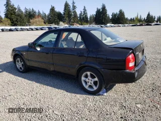 2003 Mazda Protege DX with VIN JM1BJ226231214537, listed as a Copart auction lot 54448615 with 147,753 mi miles and Salvage Title. Bid and sale history available at DreamBid. Image 2.