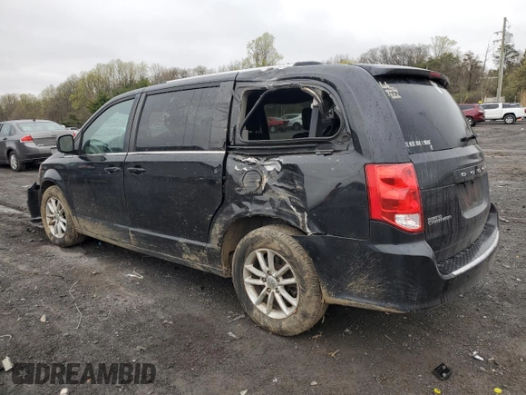 2019 Dodge Grand Caravan SXT with VIN 2C4RDGCG4KR580424, listed as a Copart auction lot 52715245 with 130,696 mi miles and Salvage Title. Bid and sale history available at DreamBid. Image 2.