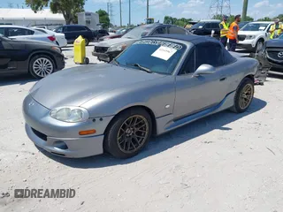 2003 Mazda MX-5 Miata Cloth with VIN JM1NB353930311340, listed as a IAAI auction lot 42145967 with 194,740 mi miles and . Bid and sale history available at DreamBid. Image 2.