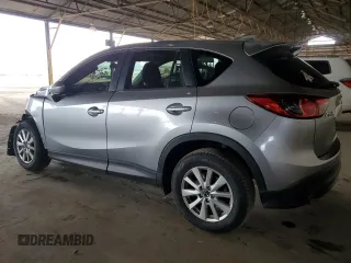 2014 Mazda CX-5 Touring z VIN JM3KE2CY7E0349484, wystawiony jako Copart lot #51188665 z przebiegiem 175 131 mil mil oraz Szkoda całkowita • Salvage title. Historia ofert i sprzedaży dostępna na DreamBid. Obrazek 2.
