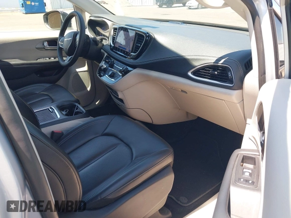 2023 Chrysler Pacifica Hybrid Touring L with VIN 2C4RC1L75PR614460, listed as a IAAI auction lot 42628545 with 68,668 mi miles and . Bid and sale history available at DreamBid. Image 5.