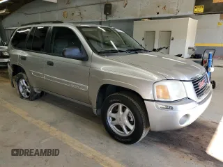 2005 GMC Envoy SLE with VIN 1GKDS13S352220344, listed as a Copart auction lot 70027194 with 234,427 mi miles and Salvage Title. Bid and sale history available at carsss.com. Image 4.
