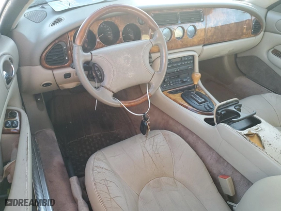 1997 Jaguar XK8 with VIN SAJGX2746VC006441, listed as a Copart auction lot 76823124 with 0 mi miles and Non Repairable. Bid and sale history available at carsss.com. Image 8.