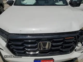 2024 Honda Pilot TrailSport z VIN 5FNYG1H60RB045659, wystawiony jako Copart lot #58575955 z przebiegiem 16 681 mil mil oraz Szkoda całkowita • Salvage title. Historia ofert i sprzedaży dostępna na DreamBid. Obrazek 12.
