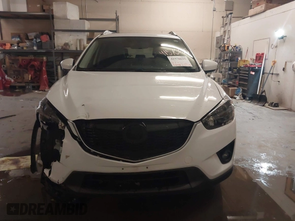 2013 Mazda CX-5 Grand Touring with VIN JM3KE4DE8D0147851, listed as a IAAI auction lot 41570695 with 94,648 mi miles. Bid and sale history available at carsss.com. Image 12.