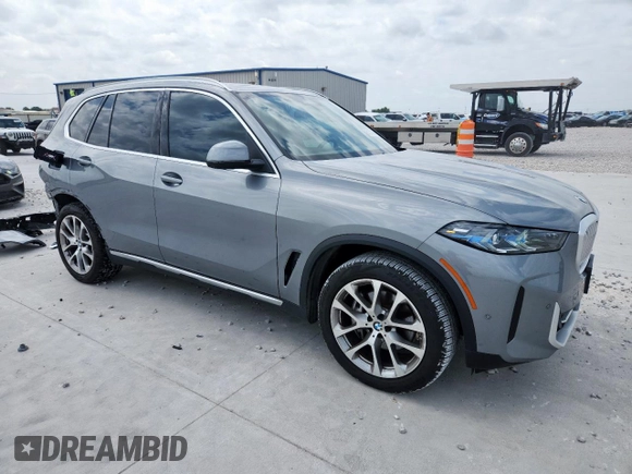 2024 BMW X5 xDrive40i with VIN 5UX23EU09R9T07066, listed as a Copart auction lot 61271495 with 18,042 mi miles and Salvage title. Bid and sale history available at DreamBid. Image 4.