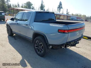 2022 Rivian R1T Adventure Package with VIN 7FCTGAAA5NN007018, listed as a IAAI auction lot 42018939 with 41,991 mi miles. Bid and sale history available at carsss.com. Image 3.