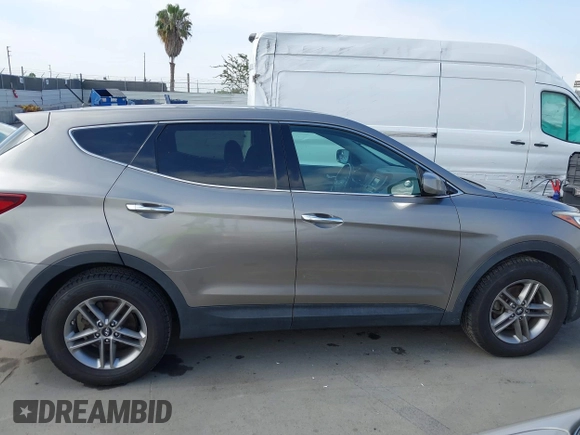 2018 Hyundai Santa Fe 2.4L with VIN 5NMZT3LB4JH069868, listed as a IAAI auction lot 42675555 with 142,612 mi miles and . Bid and sale history available at DreamBid. Image 13.