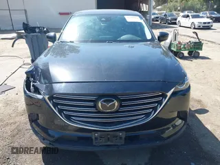 2020 Mazda CX-9 Sport with VIN JM3TCABY8L0407430, listed as a IAAI auction lot 42288490 with 50,317 mi miles and . Bid and sale history available at DreamBid. Image 12.