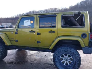 2007 Jeep Wrangler Unlimited Sahara with VIN 1J4GA59187L189519, listed as a IAAI auction lot 41204036 with 165,428 mi miles and . Bid and sale history available at DreamBid. Image 14.