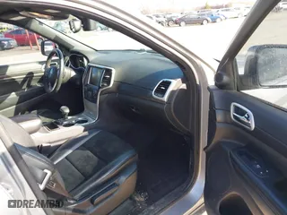 2015 Jeep Grand Cherokee Altitude with VIN 1C4RJFAG3FC210151, listed as a IAAI auction lot 41865151 with 122,579 mi miles. Bid and sale history available at carsss.com. Image 5.