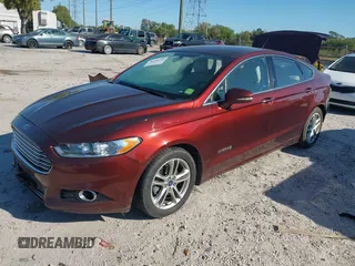 2016 Ford Fusion Titanium Hybrid with VIN 3FA6P0RU8GR127140, listed as a IAAI auction lot 41750405 with 110,861 mi miles. Bid and sale history available at carsss.com. Image 2.