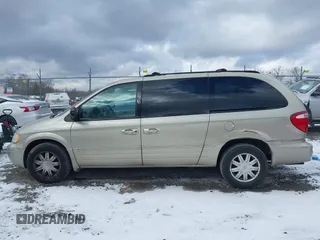2006 Chrysler Town & Country LWB Touring with VIN 2A8GP54L86R887561, listed as a IAAI auction lot 41235389 with 124,554 mi miles. Bid and sale history available at carsss.com. Image 14.