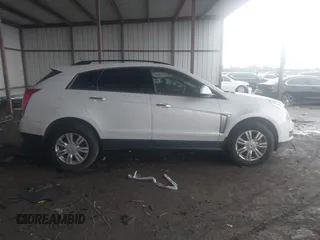 2014 Cadillac SRX z VIN 3GYFNAE32ES580480, wystawiony jako IAAI lot #42170765 z przebiegiem 148 245 mil mil oraz . Historia ofert i sprzedaży dostępna na DreamBid. Obrazek 13.