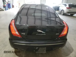 2014 Jaguar XJ with VIN SAJWA1CZ0E8V61168, listed as a Copart auction lot 54383215 with 137,724 mi miles and Salvage Title. Bid and sale history available at DreamBid. Image 6.