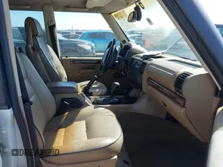 2000 Land Rover Discovery Cloth z VIN SALTY124XYA262828, wystawiony jako IAAI lot #41769729 z przebiegiem 215 711 mil mil oraz . Historia ofert i sprzedaży dostępna na DreamBid. Obrazek 5.