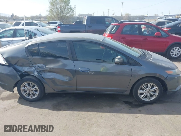 2010 Honda Insight EX with VIN JHMZE2H71AS032532, listed as a IAAI auction lot 41988221 with 333,144 mi miles and . Bid and sale history available at DreamBid. Image 13.