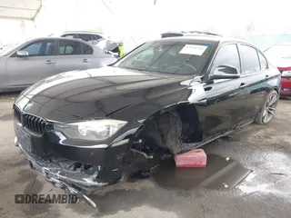2014 BMW 3 Series 328i with VIN WBA3C1G53ENR49917, listed as a IAAI auction lot 42116704 with 148,630 mi miles and . Bid and sale history available at carsss.com. Image 2.