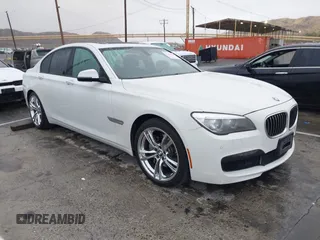 2013 BMW 7 Series 740i with VIN WBAYA6C57DC995338, listed as a IAAI auction lot 41479077 with 123,680 mi miles. Bid and sale history available at carsss.com. Image 1.
