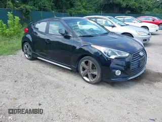 2013 Hyundai Veloster Turbo with VIN KMHTC6AE2DU111256, listed as a IAAI auction lot 42796383 with 127,660 mi miles and . Bid and sale history available at DreamBid. Image 1.