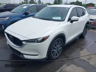 2018 Mazda CX-5 Touring with VIN JM3KFBCMXJ0366008, listed as a IAAI auction lot 42079989 with 153,868 mi miles and . Bid and sale history available at DreamBid. Image 2.