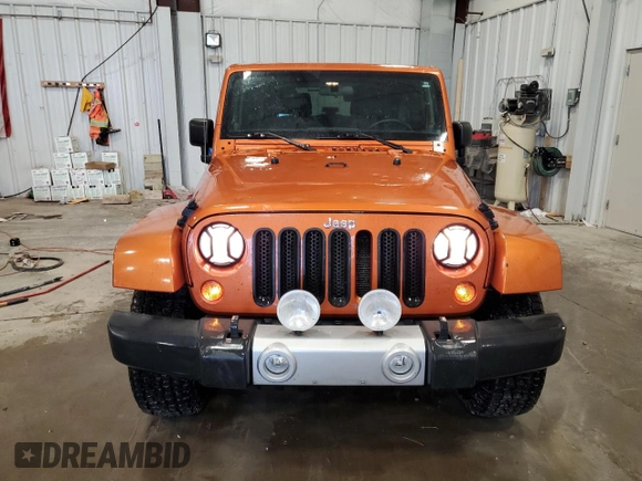 2011 Jeep Wrangler Sahara with VIN 1J4GA5D1XBL557392, listed as a Copart auction lot 56892835 with 109,567 mi miles and Clean title. Bid and sale history available at DreamBid. Image 5.