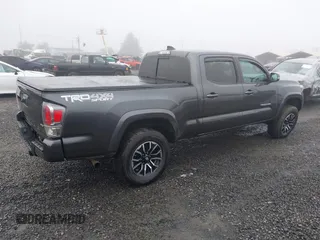 2021 Toyota Tacoma 4WD SR5 with VIN 3TMDZ5BN4MM099423, listed as a IAAI auction lot 41208397 with 62,935 mi miles. Bid and sale history available at carsss.com. Image 4.