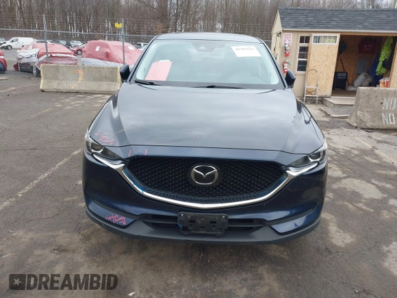 2021 Mazda CX-5 Touring with VIN JM3KFBCM7M1380396, listed as a IAAI auction lot 41707612 with 55,555 mi miles. Bid and sale history available at carsss.com. Image 12.